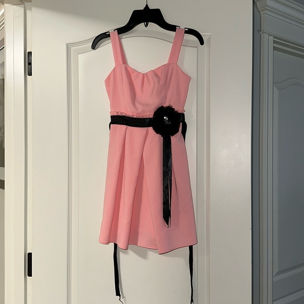 Roxette light pink dress with a black flower(bow) , size 7